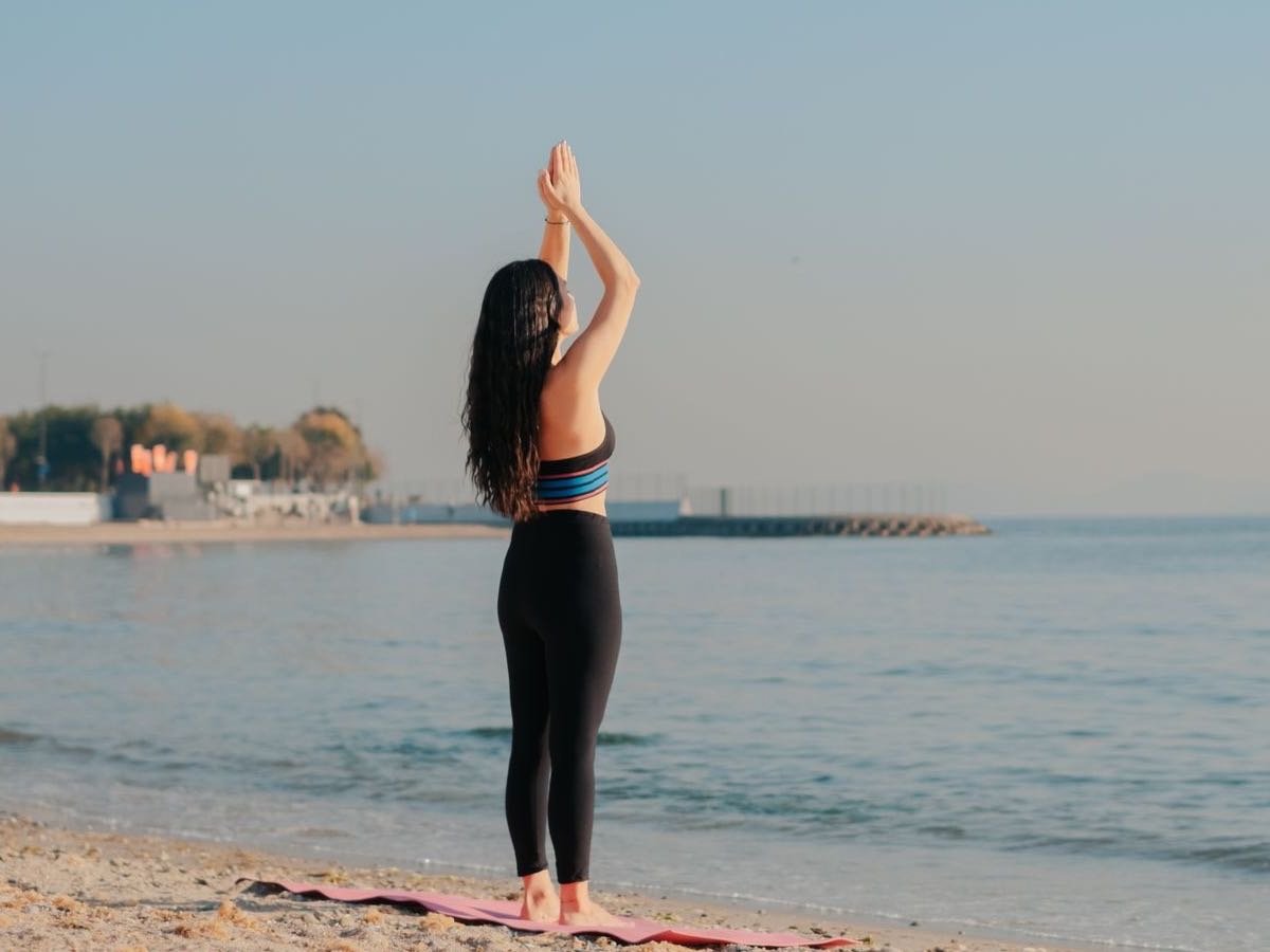 Beach yoga by the sea
