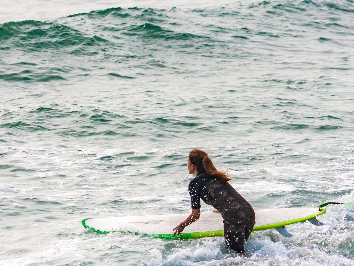 Surfer entering the water